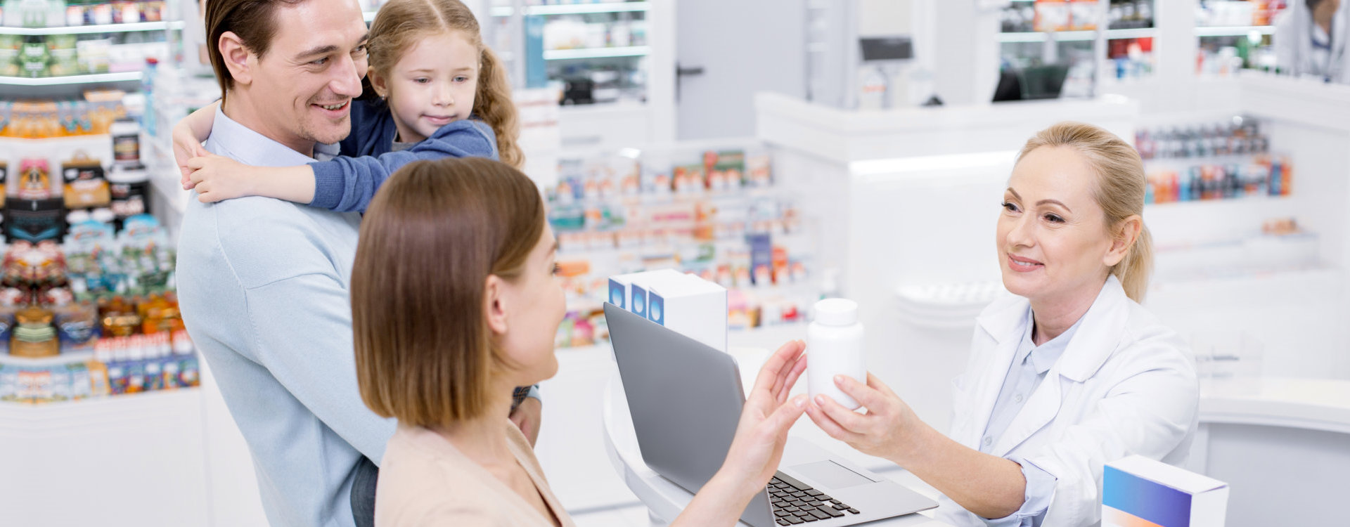 family customer talking to a pharmacist